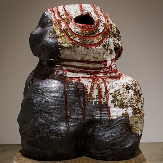 A statue of a person with a hole in the middle