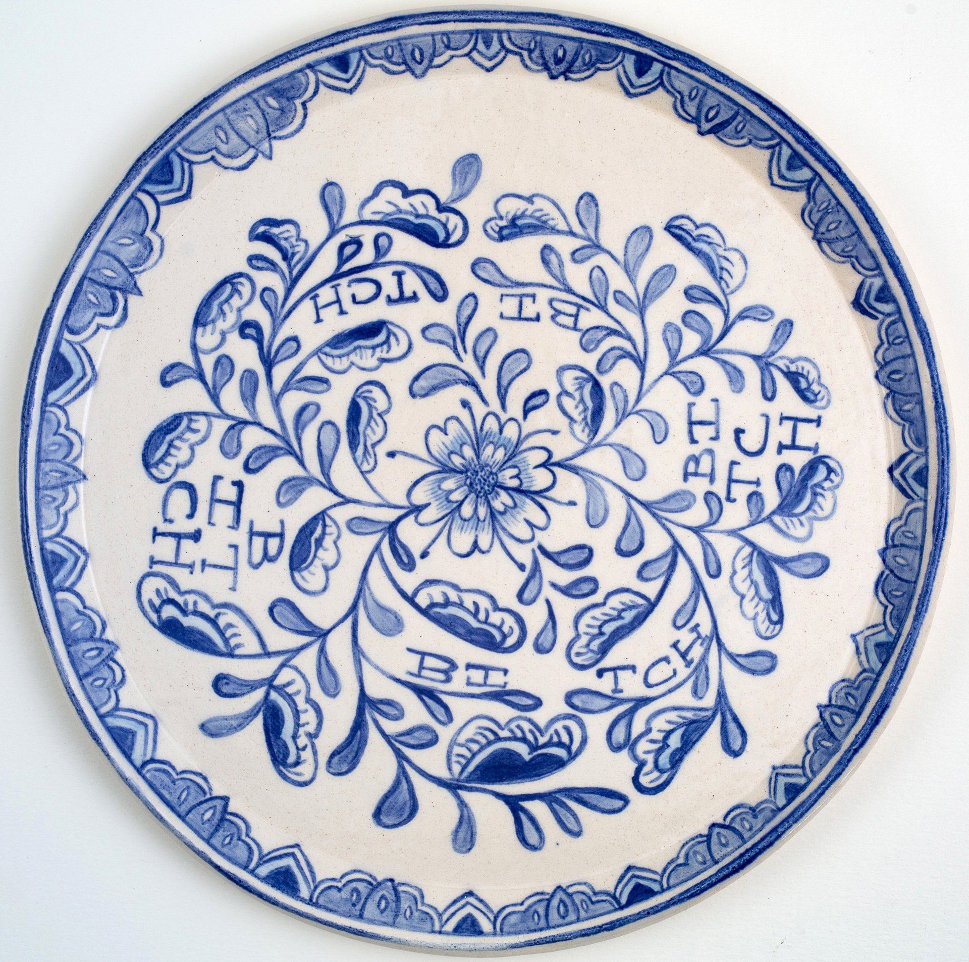 A blue and white plate with a floral design on it