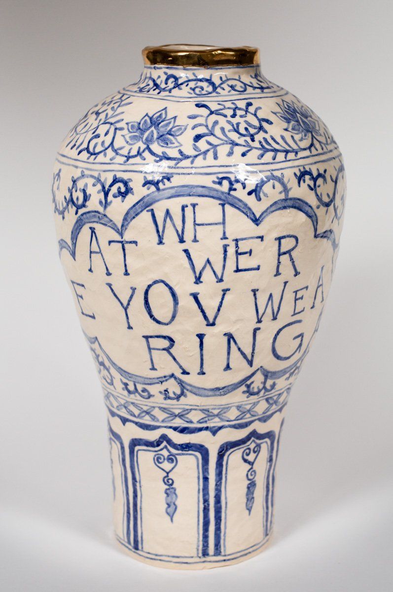 A blue and white vase that says at when you we ring
