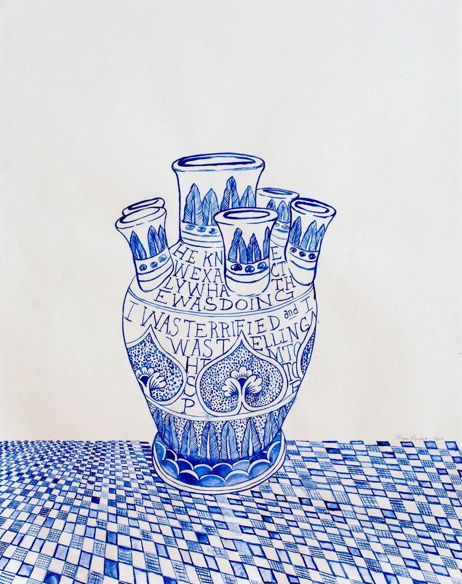 A blue and white vase is sitting on a table.
