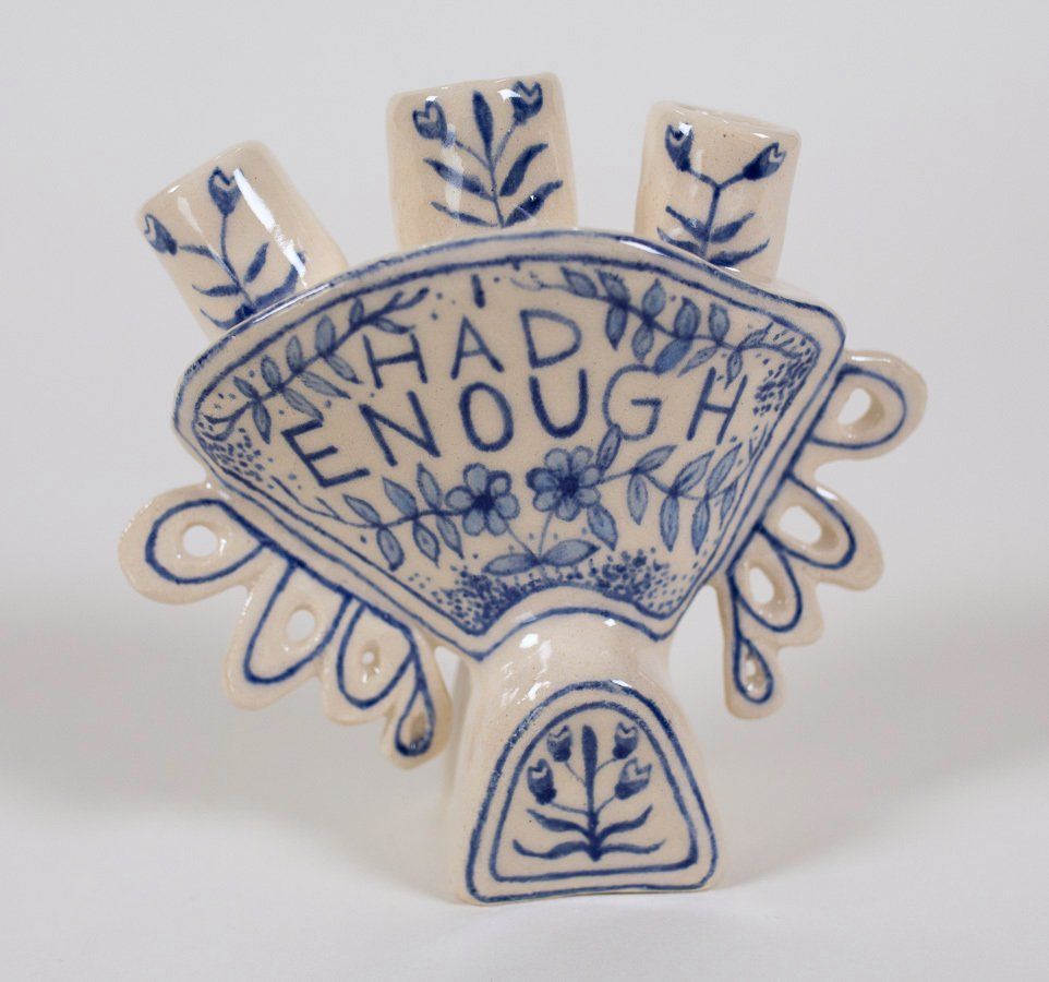 A blue and white fan with the words