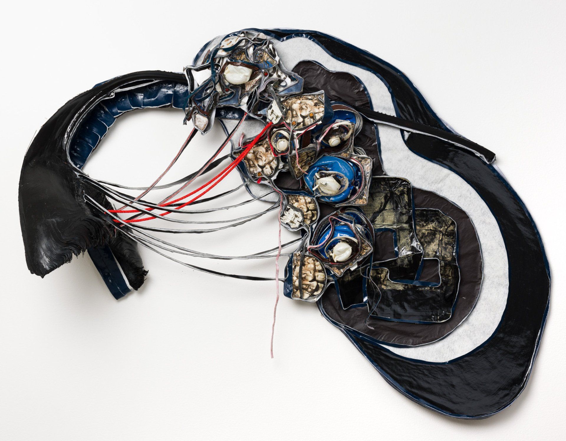 A black and white sculpture with a swirl in the middle