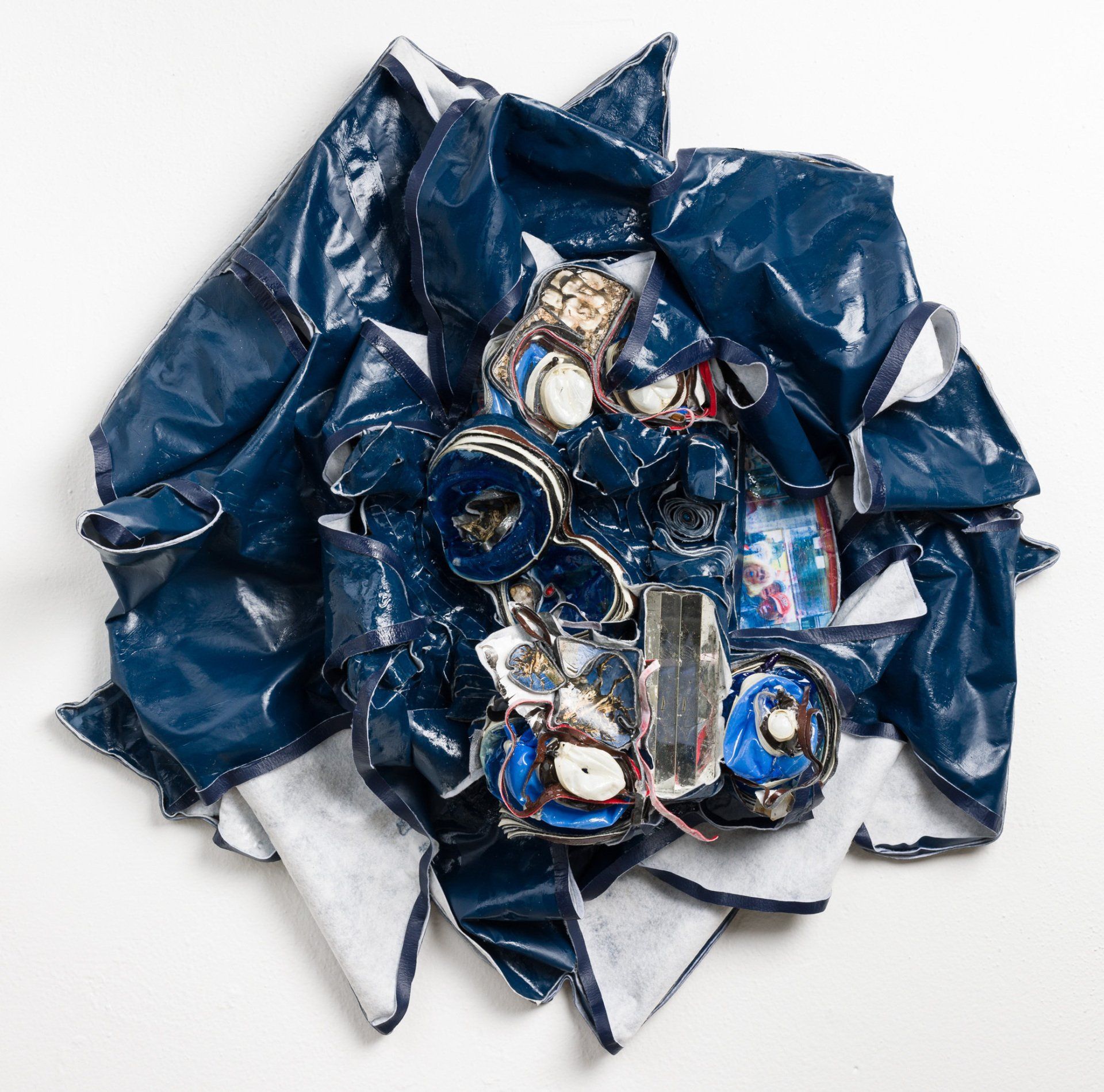 A bunch of cans are laying on a white surface