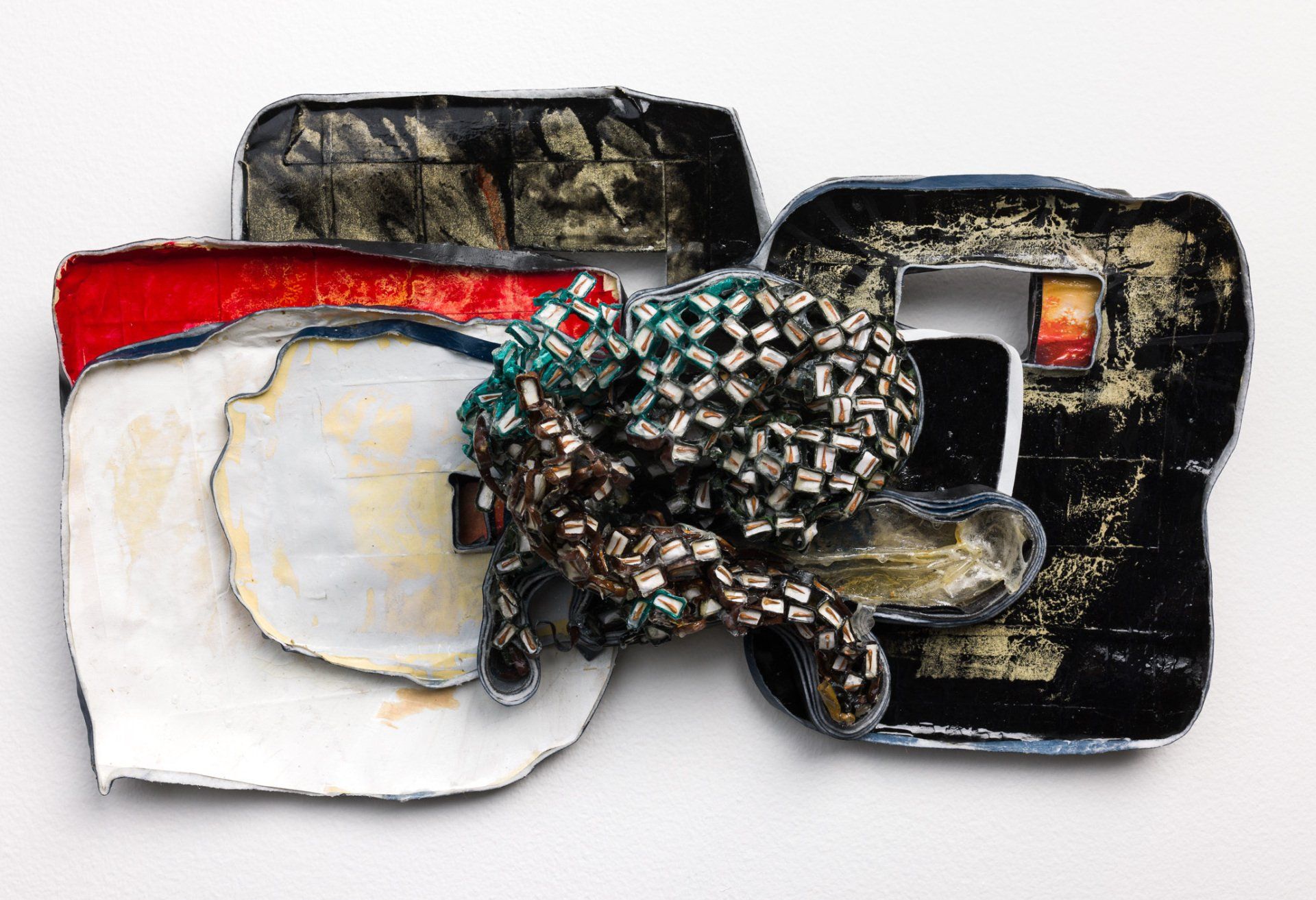 A piece of art that looks like a piece of bread is on a white surface.