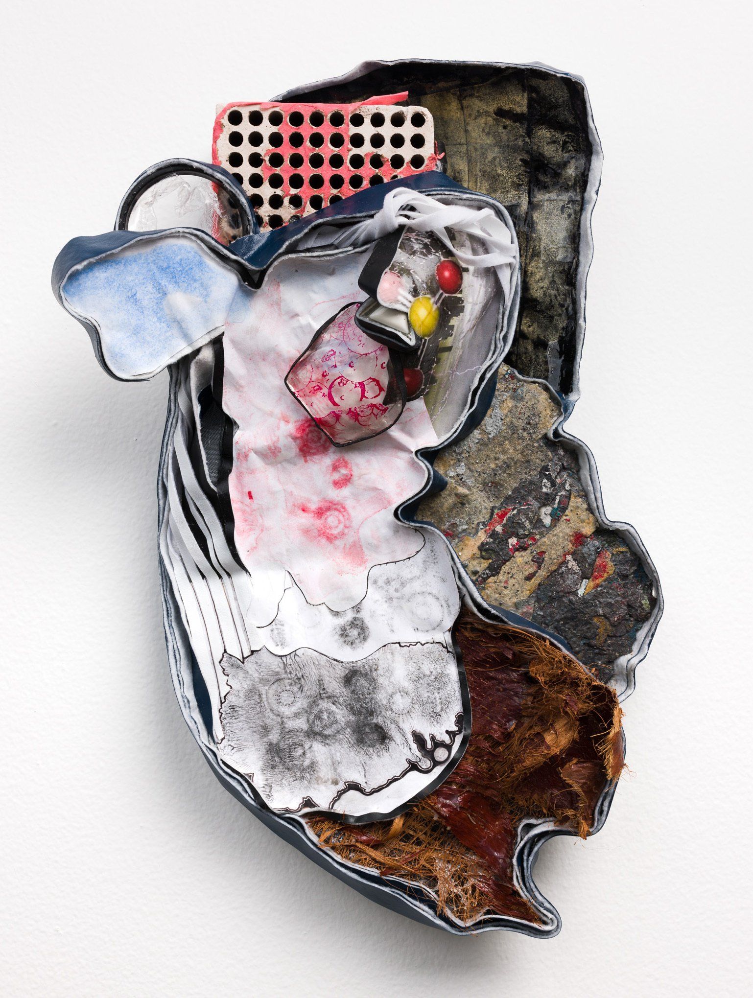 A close up of a sculpture on a white surface