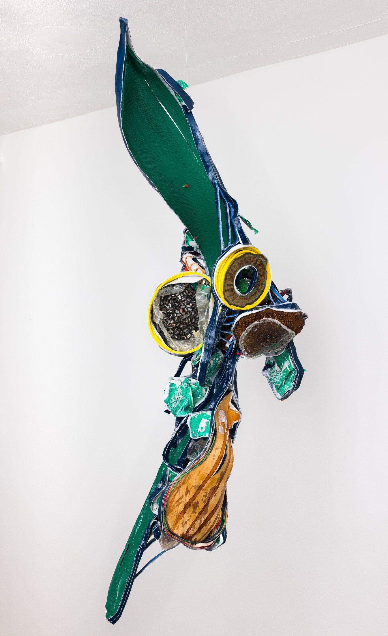 A colorful sculpture is hanging from the ceiling.