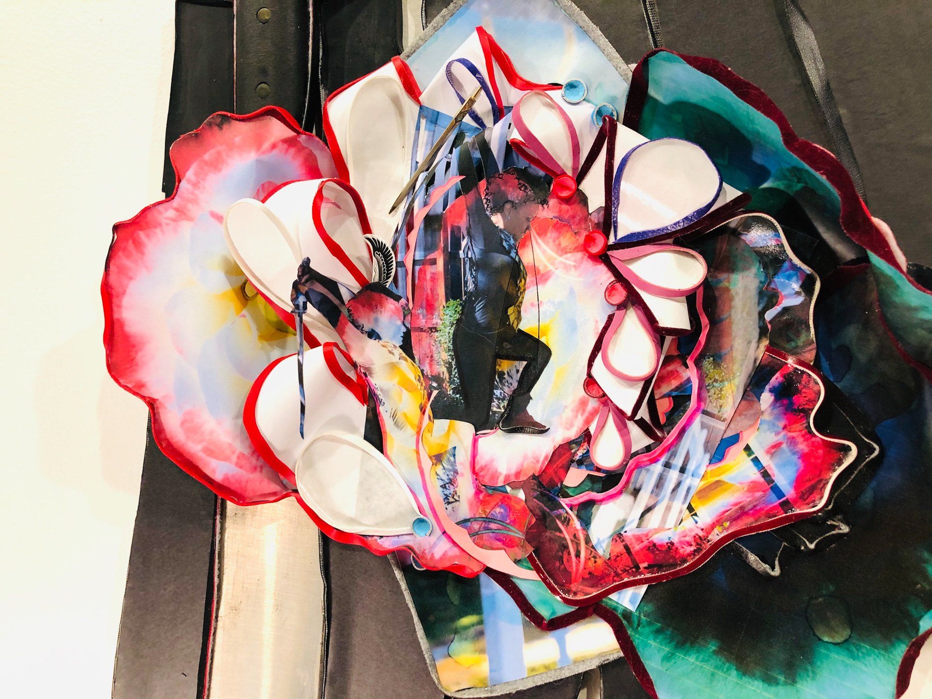 A painting of a flower with a man in the center