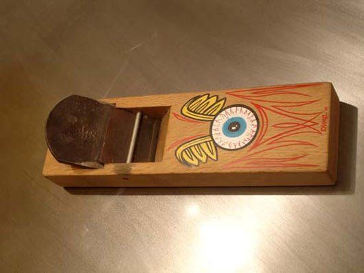 A wooden plane with a cartoon eye on it