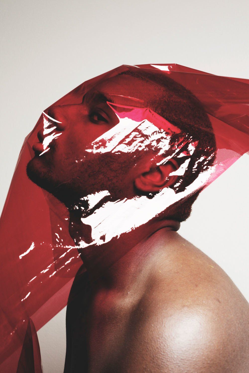 A man with a red scarf around his head