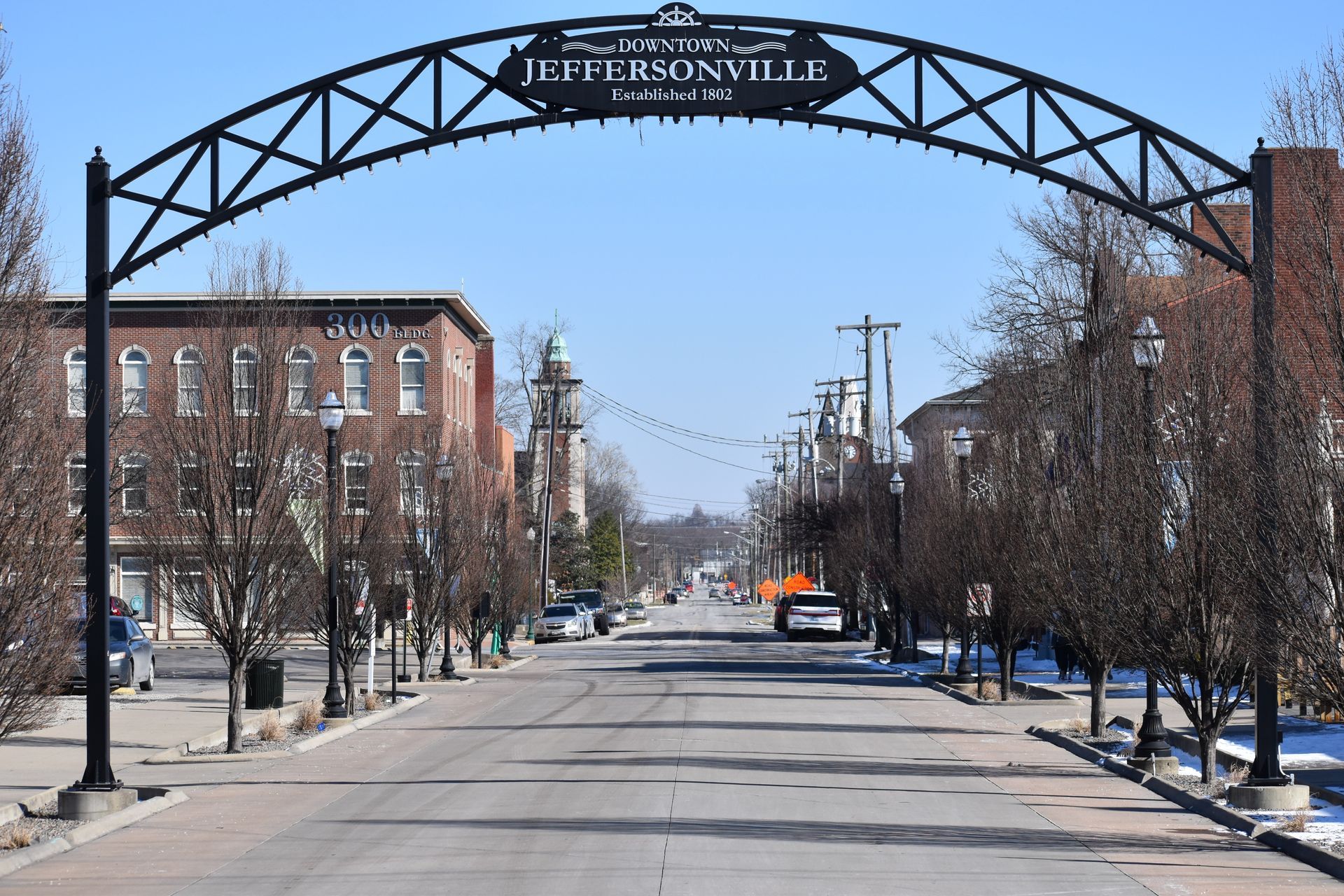 Two beagle dogs are sitting in the back of a vehicle.