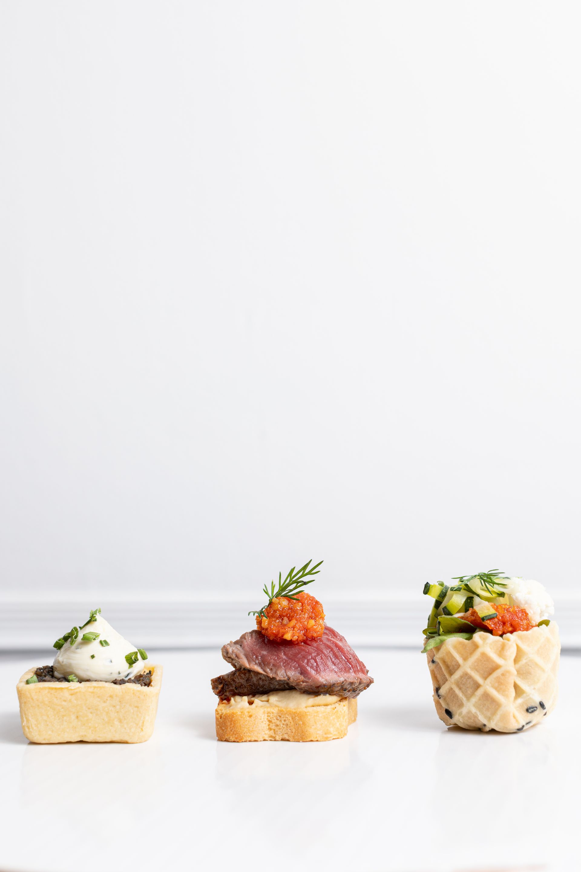 Three different types of food are on a white plate.