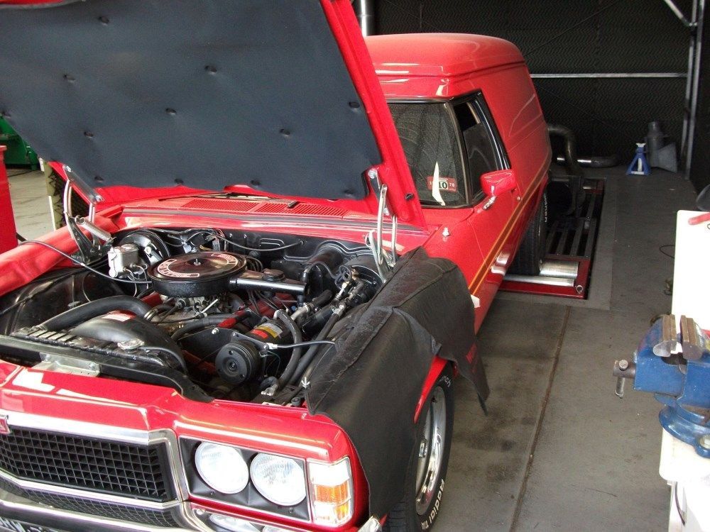 A Red Car With The Hood Open In A Garage — Gympie Diesel & Dyno Centre in Glanmire, QLD