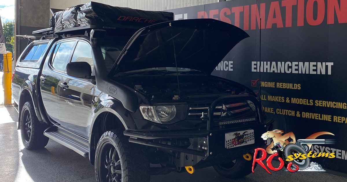 A Black Truck With The Hood Up — Gympie Diesel & Dyno Centre in Glanmire, QLD