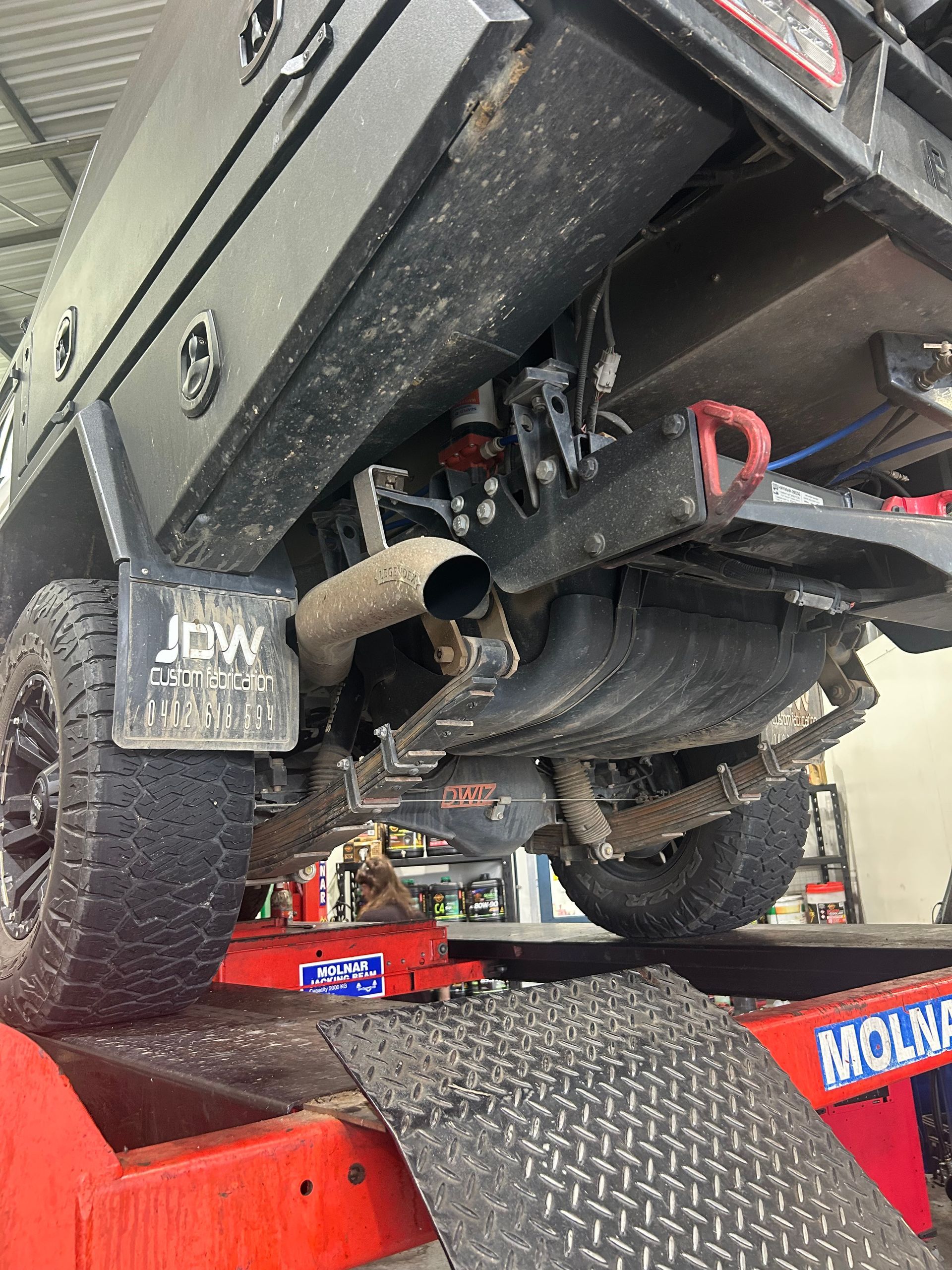 A Close Up Of The Underside Of A Car With A Exhaust Pipe — Gympie Diesel & Dyno Centre in Glanmire, QLD