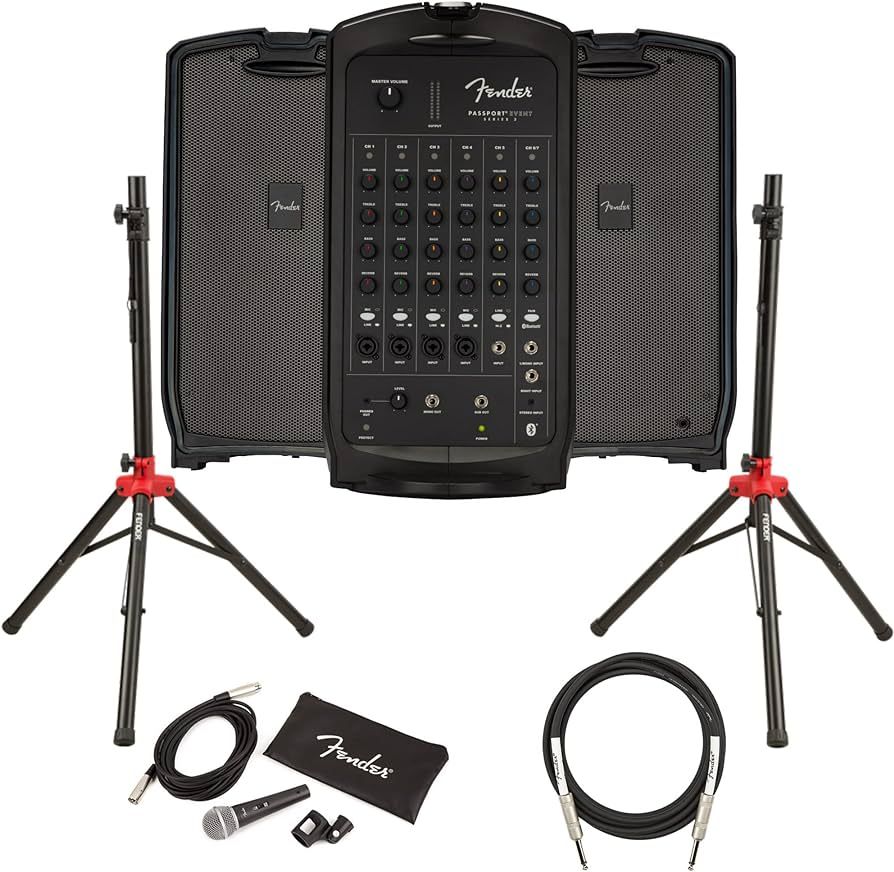 A fender portable pa system with speakers , microphones , and cables.