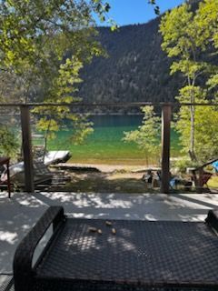 View of a lake and mountains from a deck