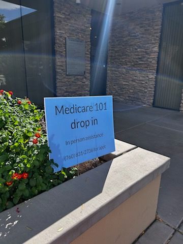 A blue sign in front of a building