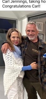 A man and woman smiling