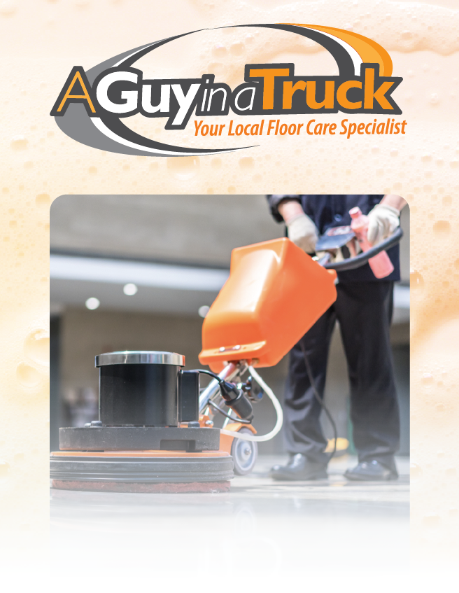 A Guy in a Truck logo above a floor cleaner using an orange scrubber in a bright indoor space