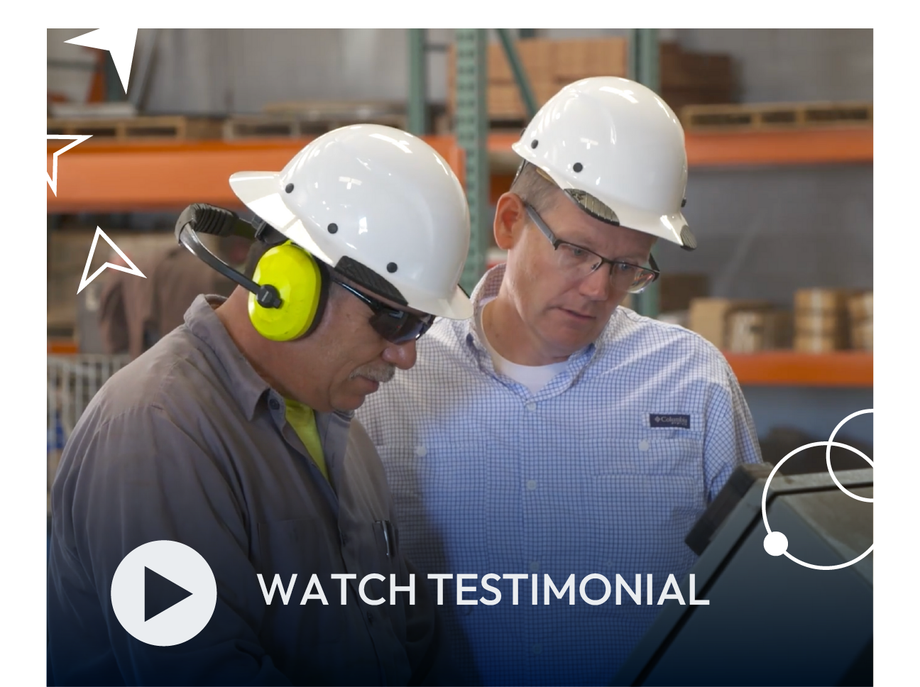 Two workers in hard hats reviewing plans in a warehouse, with a “Watch Testimonial” play button overlay.