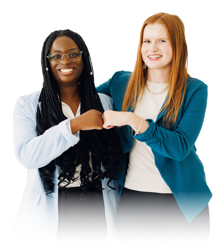 Two smiling coworkers fist-bump against a white background