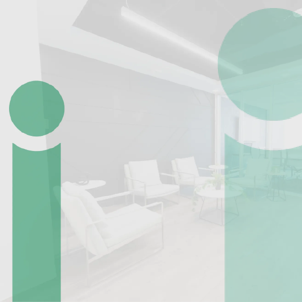 Abstract green circles over a faded modern lounge with chairs and a table