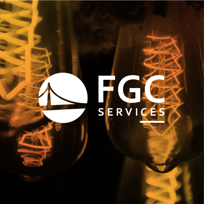 FGC Services logo over warm orange-lit hanging light bulbs