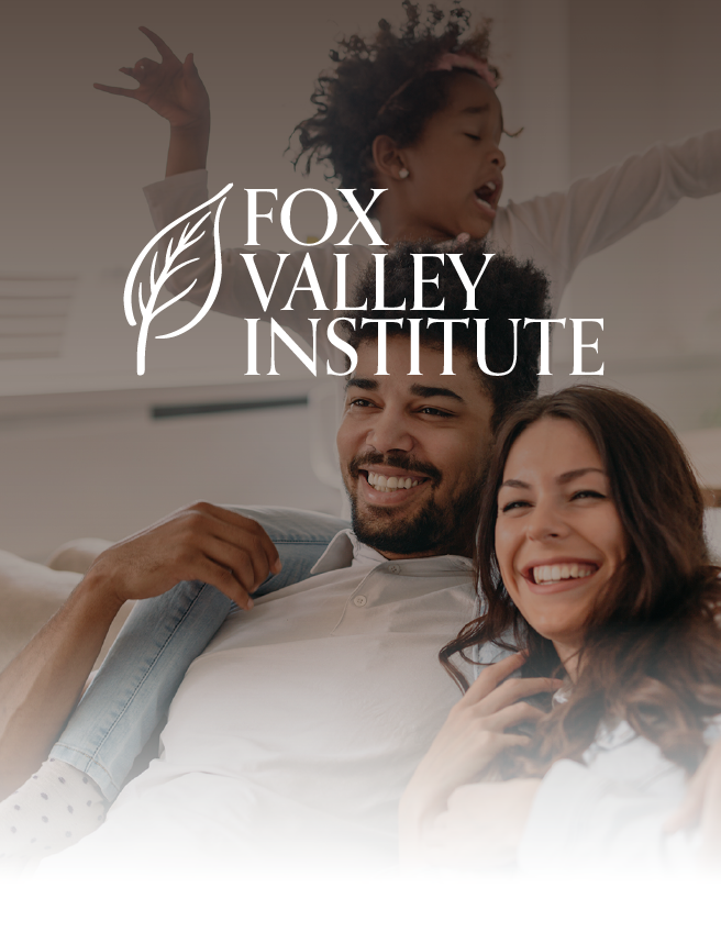 Fox Valley Institute logo over smiling couple and child in a warm, softly lit family scene