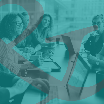 People in a meeting around a table, seen through a teal geometric overlay.