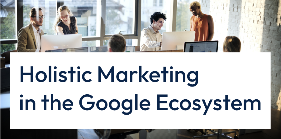 Team meeting in an office with banner reading “Holistic Marketing in the Google Ecosystem”