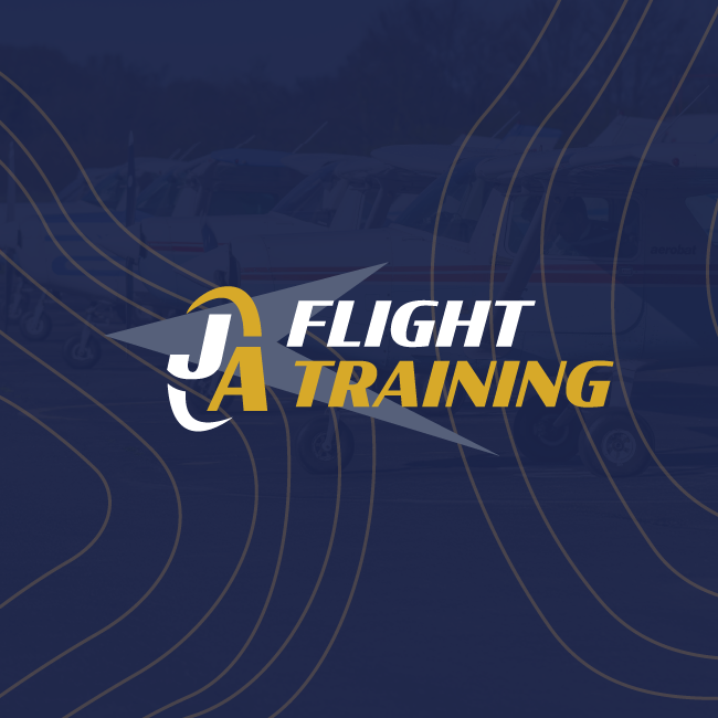 JA Flight Training logo on a dark blue background with gold and white wave lines