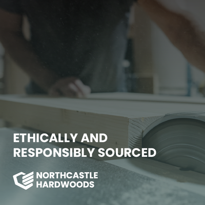 Ethically and responsibly sourced Northcastle Hardwoods logo over a wood slab in a workshop