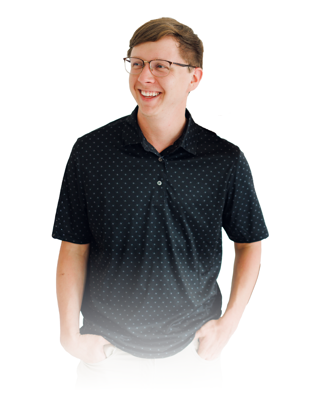 Smiling person in a black patterned polo shirt, standing against a white background.