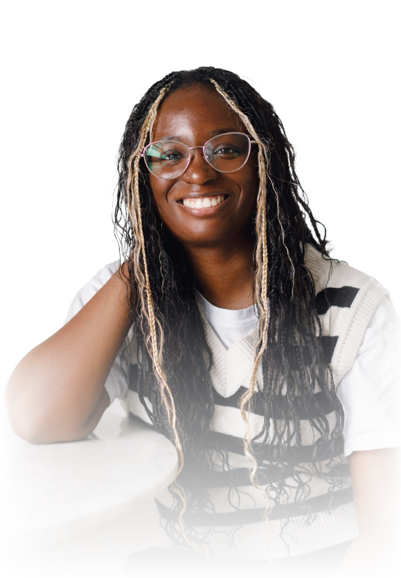 Smiling woman in glasses, black blazer, and white blouse against a white background