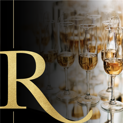 Gold letter R over champagne flutes on a warm, elegant background