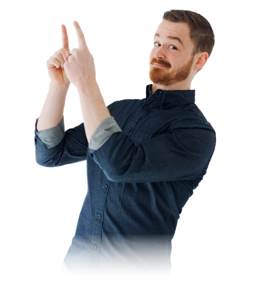 Man in a dark blue shirt pointing upward with both hands on a white background