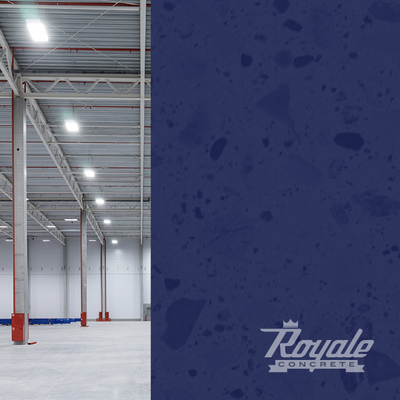 Empty industrial warehouse interior beside a blue wall with Royal Concrete logo