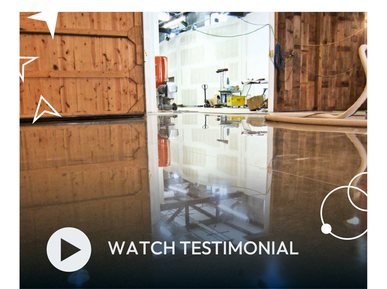 Open barn doors reveal a bright workspace reflected on a glossy floor, with “Watch Testimonial” button.
