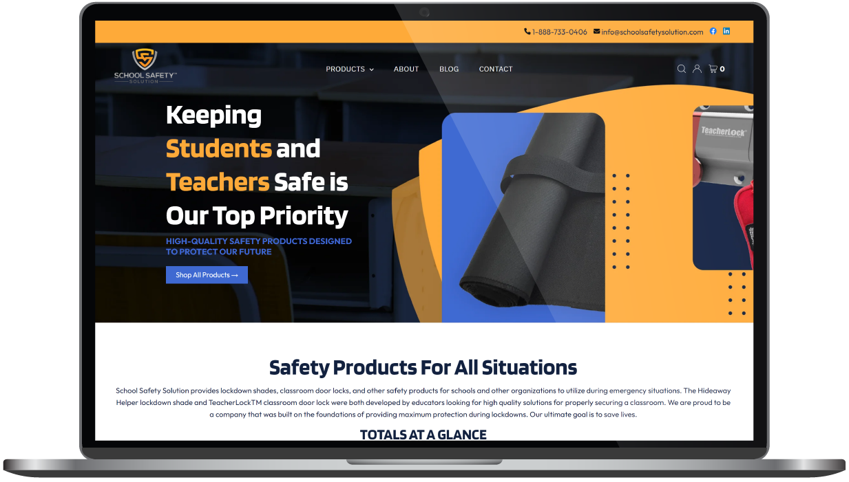 Laptop displaying school safety product website with dark banner and orange protective gear graphics