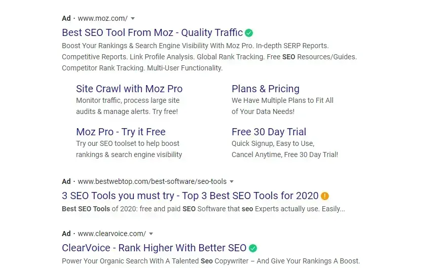 Google search results for Moz SEO tools, with blue links and snippets on a white page