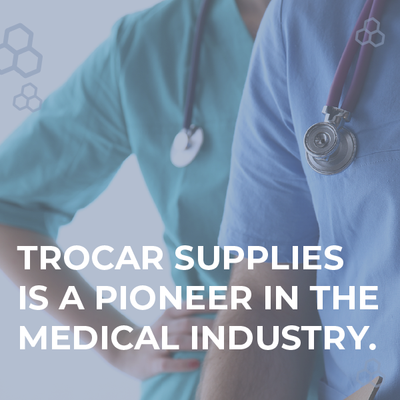 Two medical staff in blue scrubs with stethoscopes, overlaid text: “Trocar Supplies is a pioneer in the medical industry.”