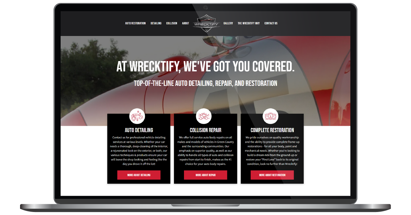 Laptop displaying a dark website homepage with the headline “At We Work For You, We’ve Got You Covered” and three service cards.