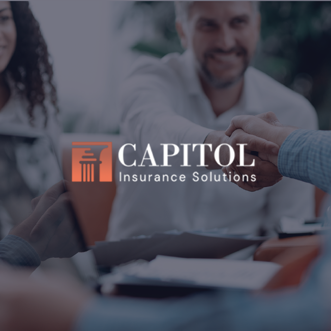 Capitol Insurance Solutions logo over a blurred office meeting scene