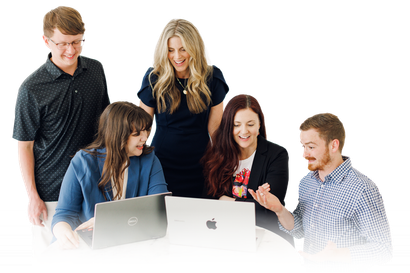 Five coworkers gathered around laptops, looking at a screen and collaborating in a bright office.