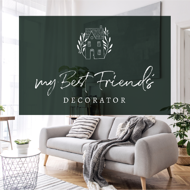 Living room with gray sofa and decor wall art reading “My Best Friend’s Decorator”