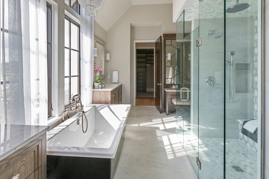 A bathroom with a bathtub and a walk in closet – San Bernardino, CA - Safe Glass Window Replacement Inc.