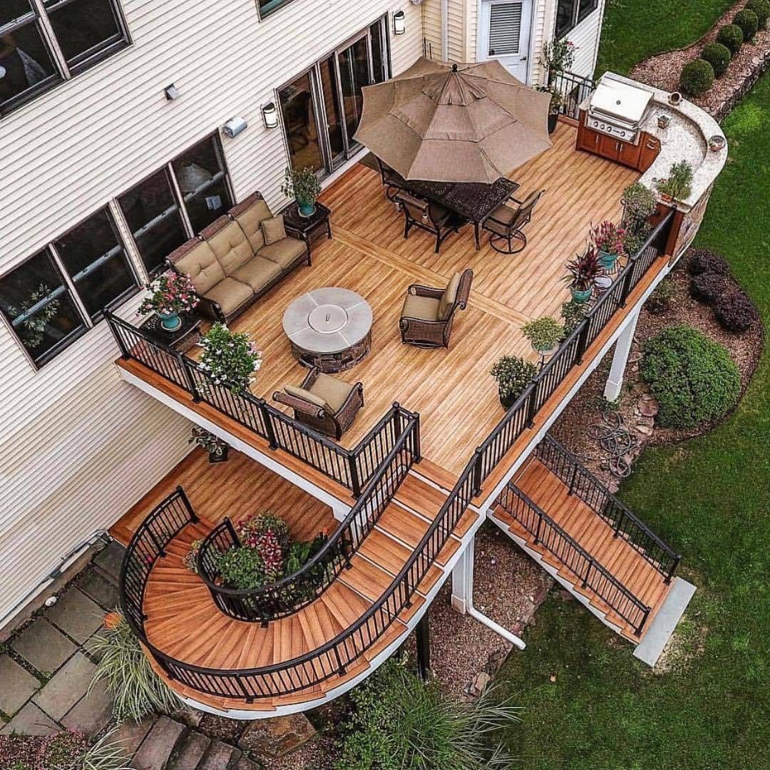 Spacious multi-level deck design with build in grilling station perfect for backyard gatherings in Maryland