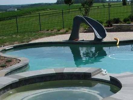 There is a slide in the middle of the pool.