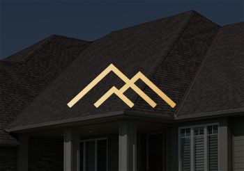 A picture of a house with a logo on the roof