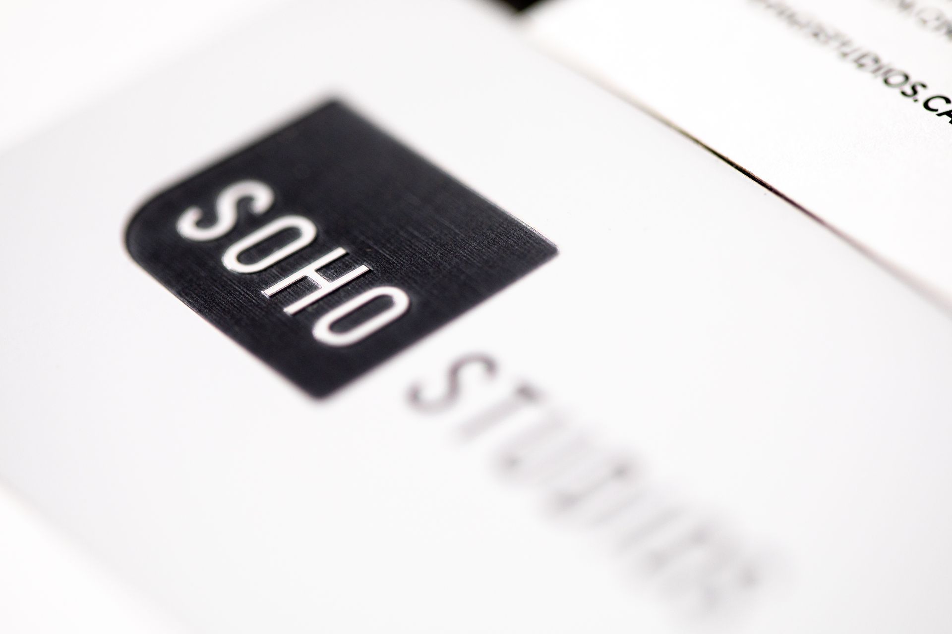 a close up of a business card for soho suites